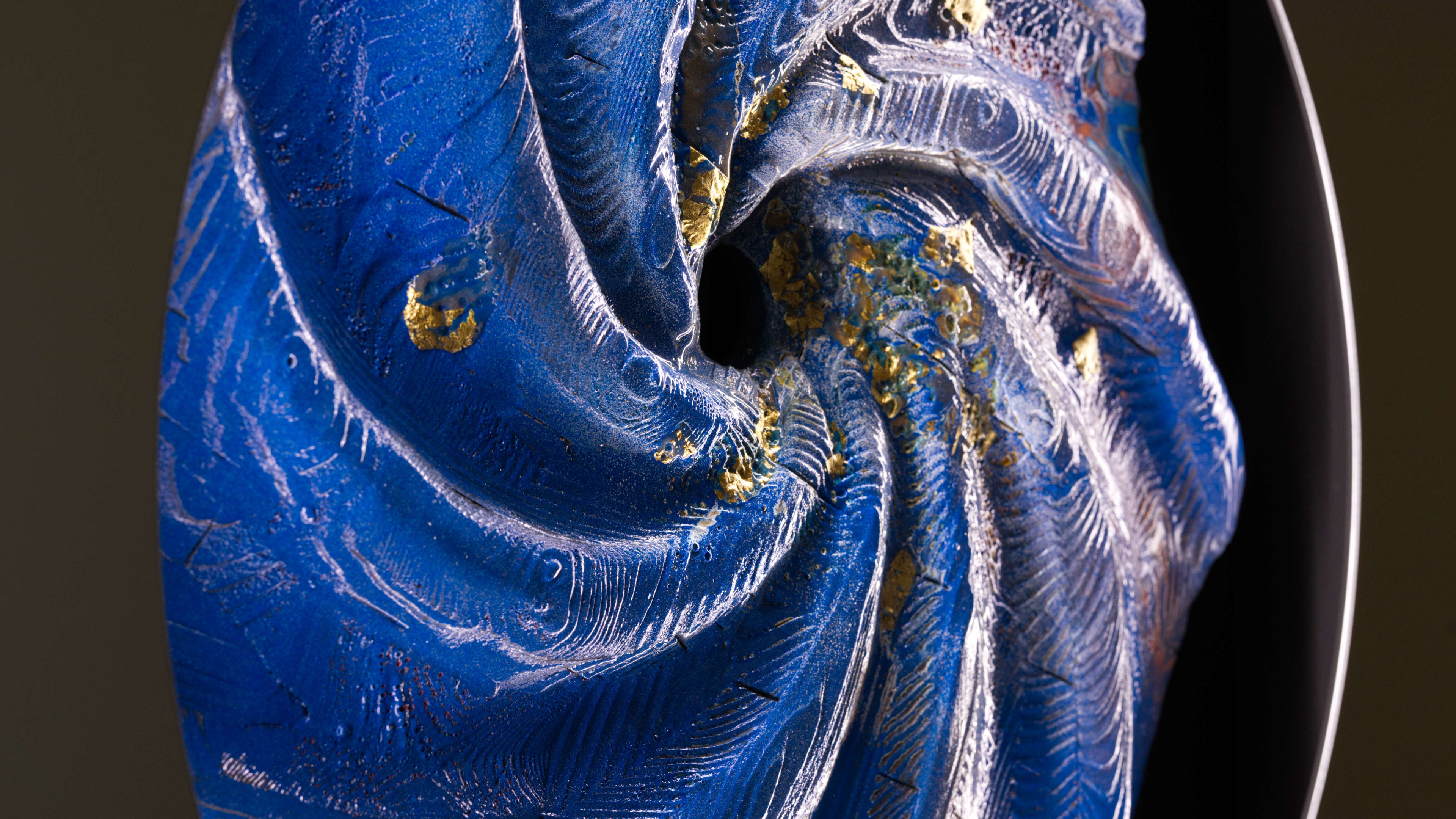 Close-up of blue spiral light artwork with textured fire-shaped surface and gold leaf details, abstract circular fine art print Cherulight by Burningpictures