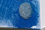 Artist signature of Thomas Girbl in transparent fire-fused pigment on Memory of the Primordial Sea, lower right corner