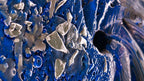 Close-up of Pedelight artwork showing ultramarine textures and embedded palladium fragments, abstract circular fine art print by Burningpictures