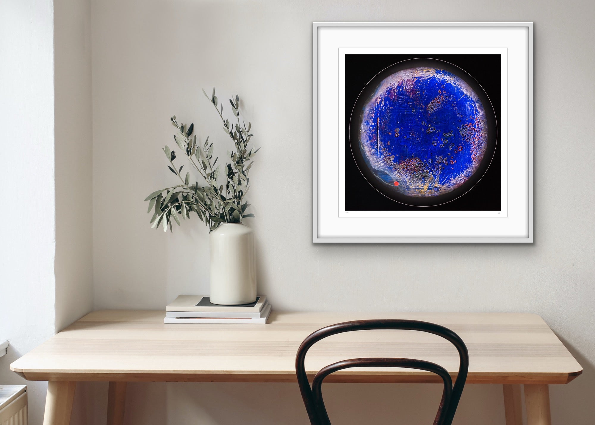 Seasolight framed light art print on modern wall interior, deep blue circular artwork inspired by ocean depth by Burningpictures
