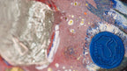 Detail of Pallaurumlight Burning Lightobject by Thomas Girbl showing artist seal and gold leaf texture